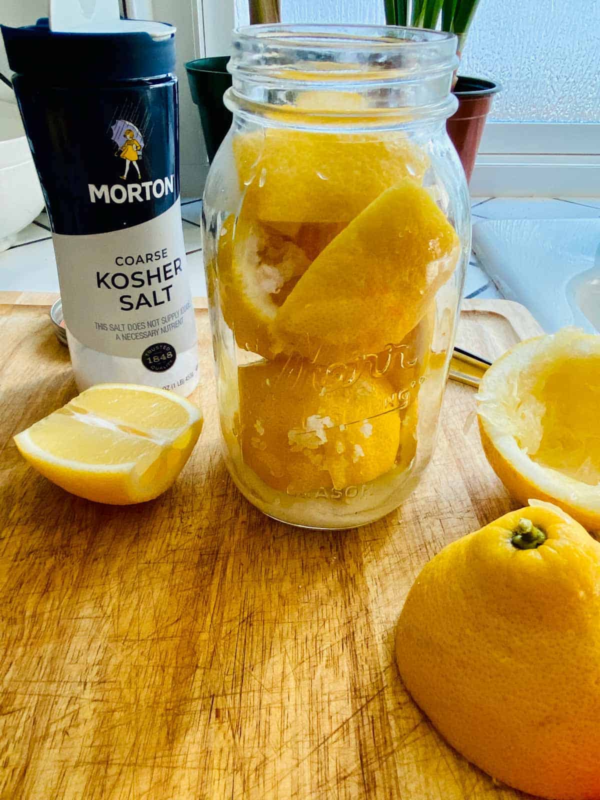 Mason jar filled with lemons packed with salt