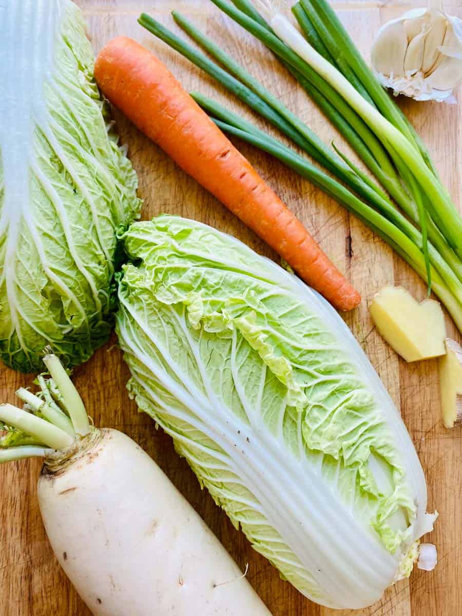 Napa cabbage, daikon, carrot, green onions, garlic, and ginger