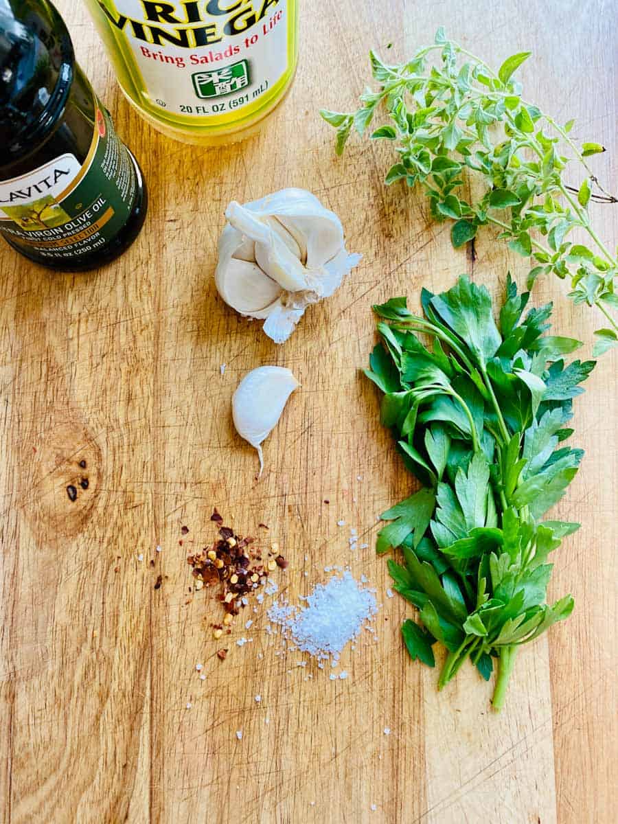 Marinade ingredients: garlic, parsley, thyme, salt, vinegar, olive oil