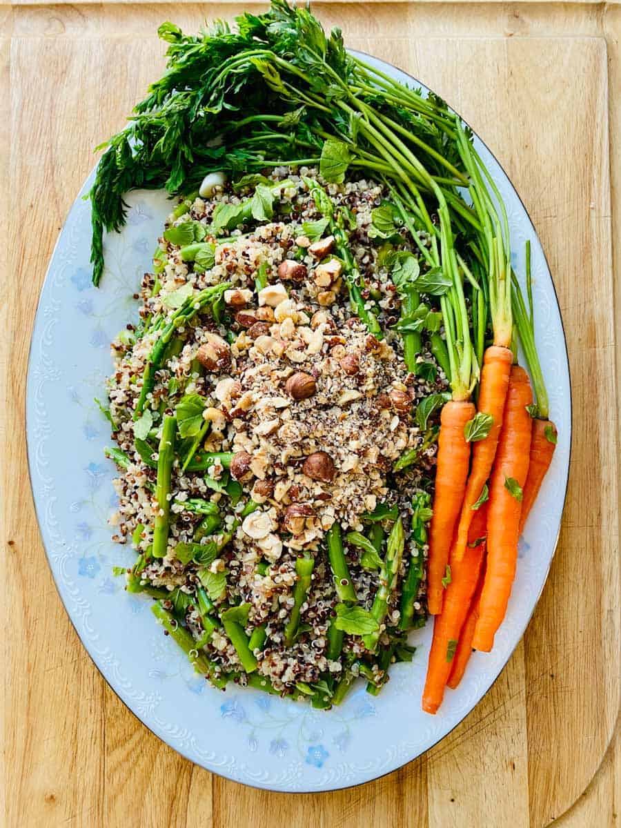 Asparagus Quinoa Salad garnished with small carrots.