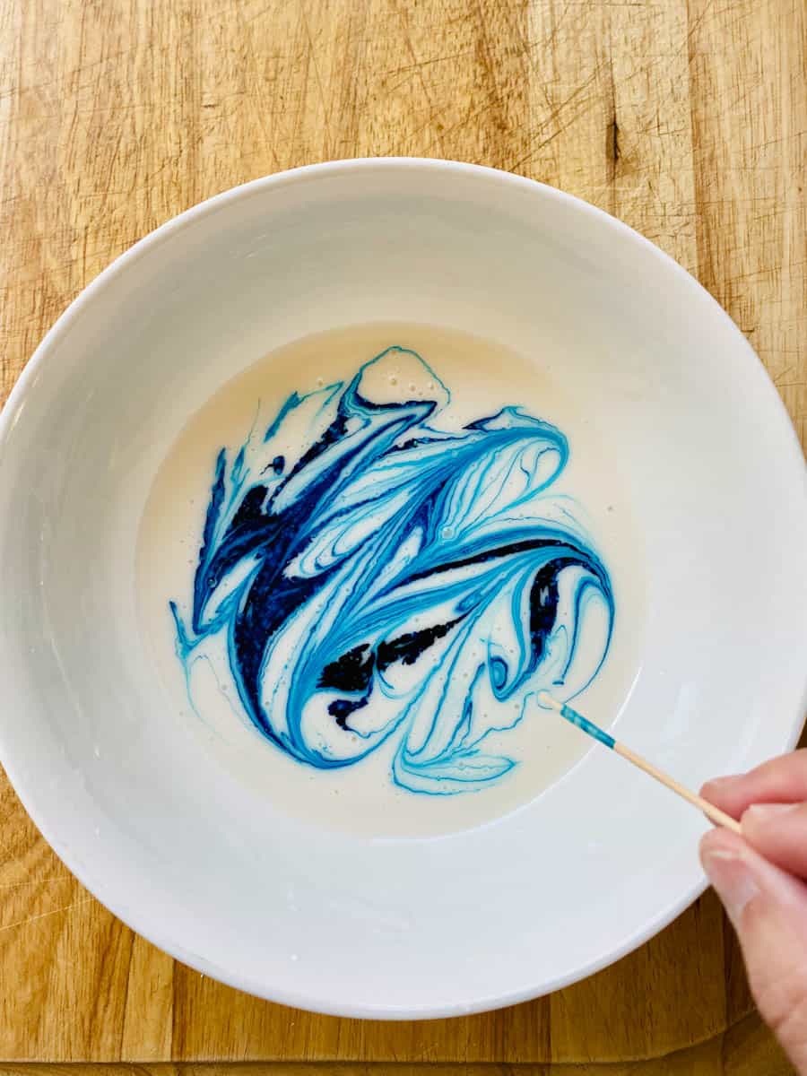 White icing with loops of blue food coloring.
