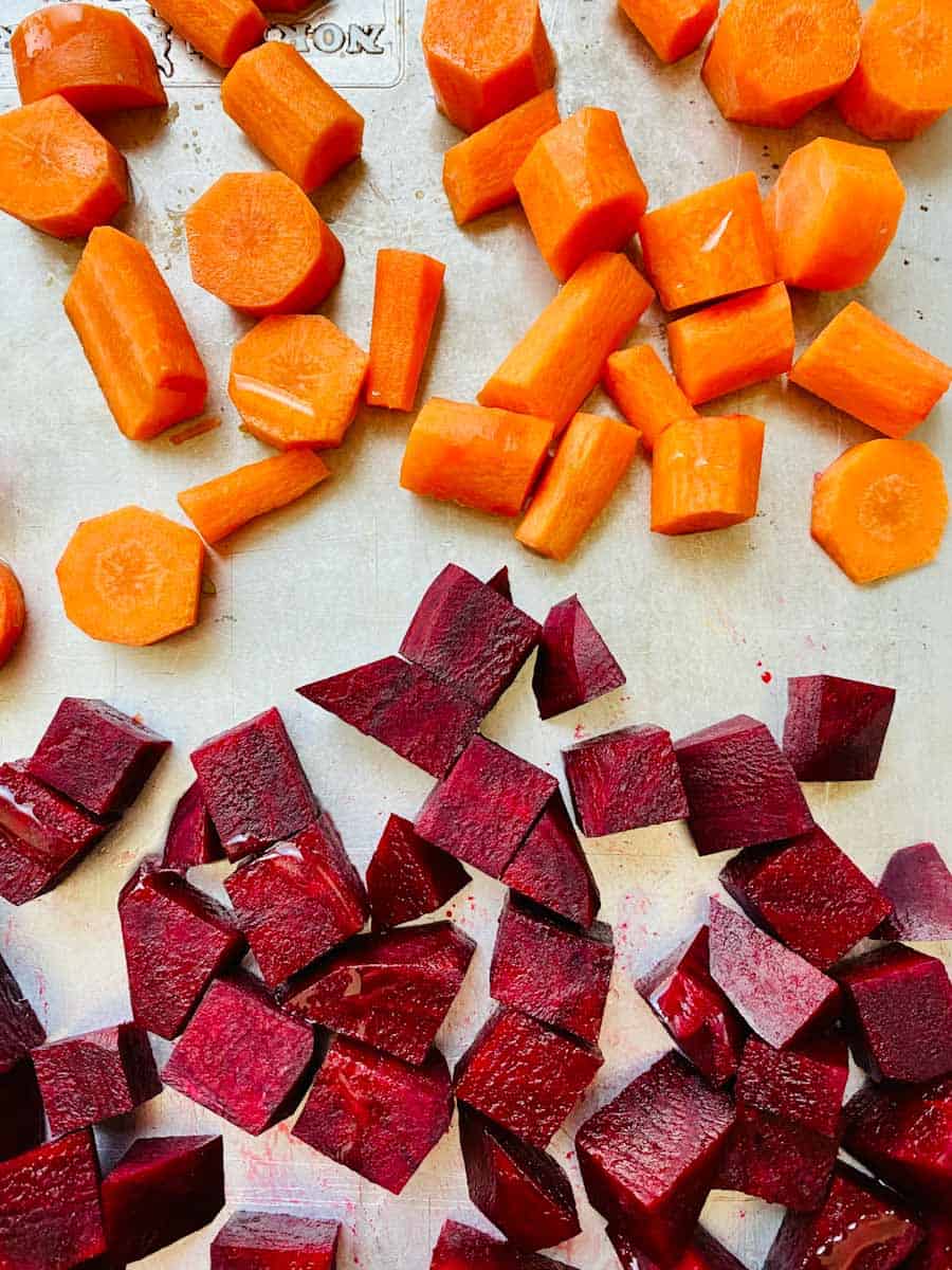 Pan of diced beets and carrots to be roasted.