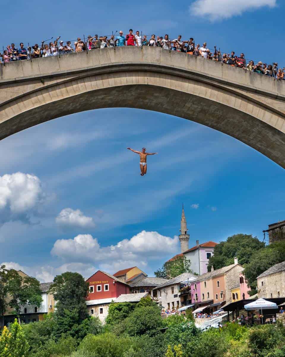 I just don't know about this: a person jumping off a bridge in his underpants with a crowd watching.