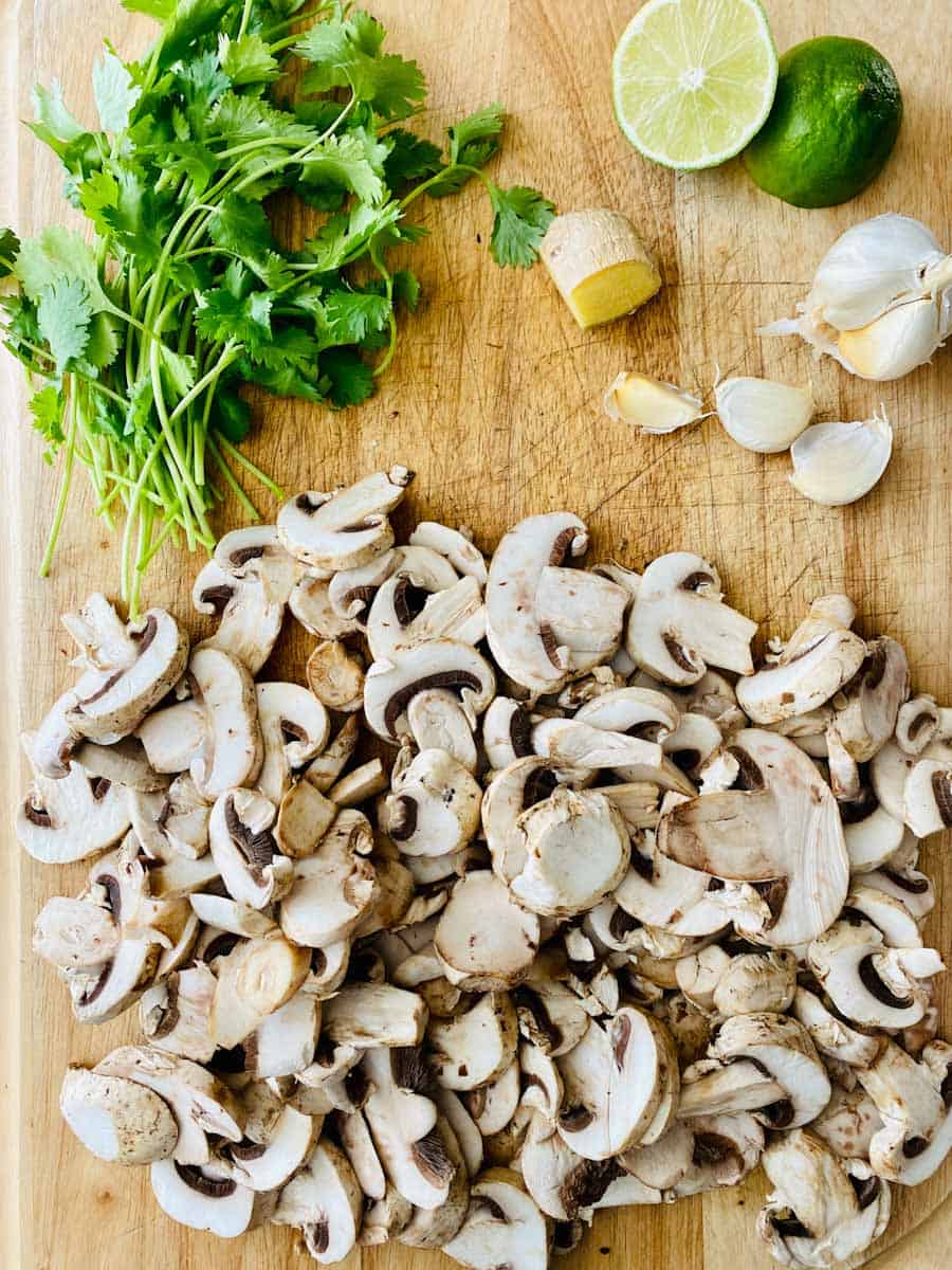 Sliced mushrooms with cilantro, ginger, garlic, and lime.