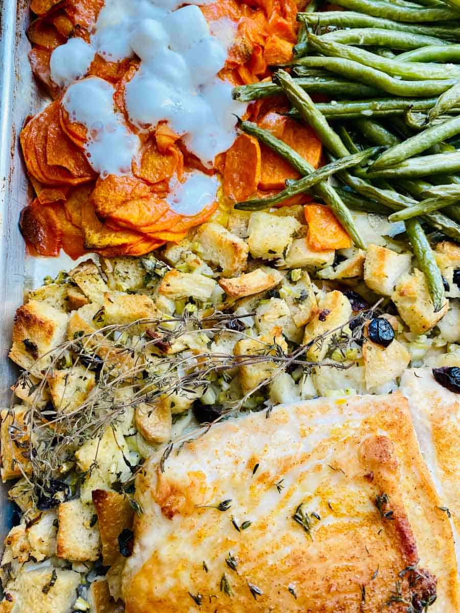 Sweet potatoes with melty marshmallows, garlicky green beans, stuffing, and golden turkey.