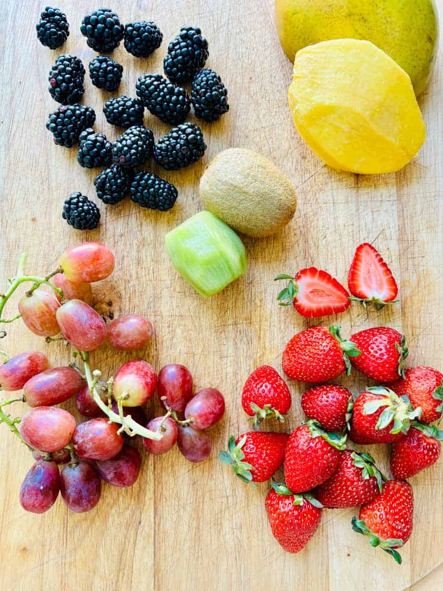 Blackberries, mango, strawberries, kiwi, and red grapes.
