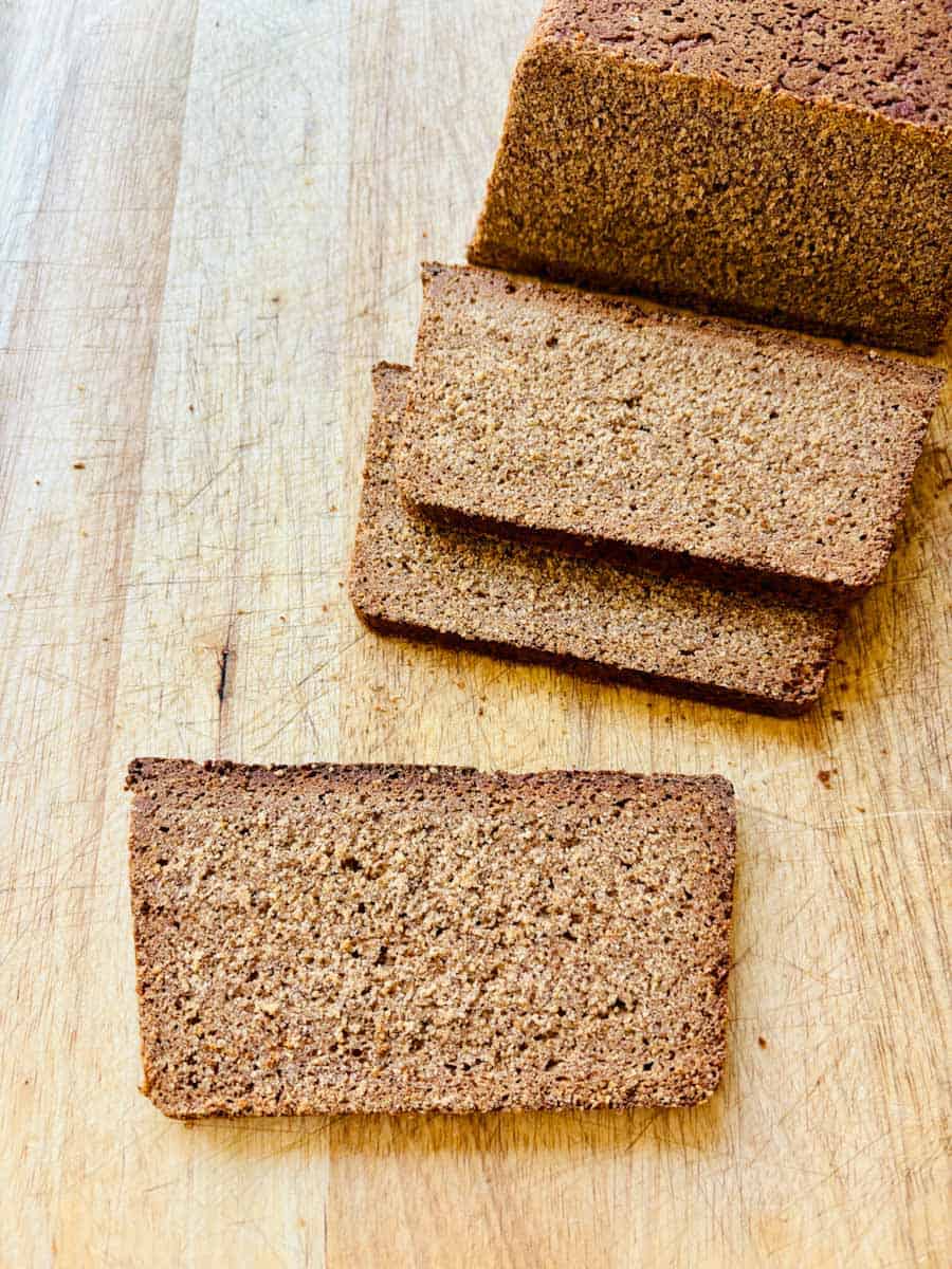 Nordic rye bread sliced on a cutting board.