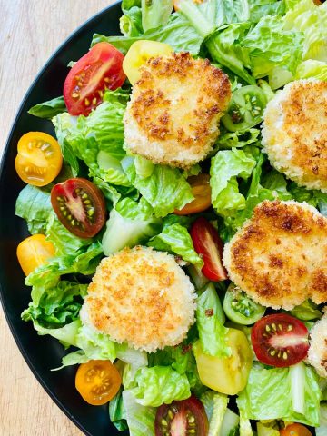 Salad with fried goat cheese rounds.