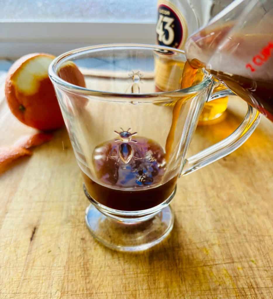 Hot coffee poured into a mug.
