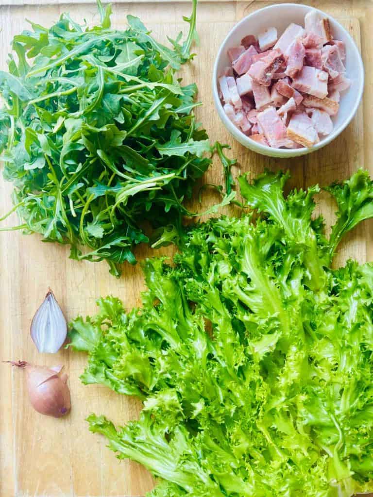 Arugula, bacon, curly endive, and shallots.