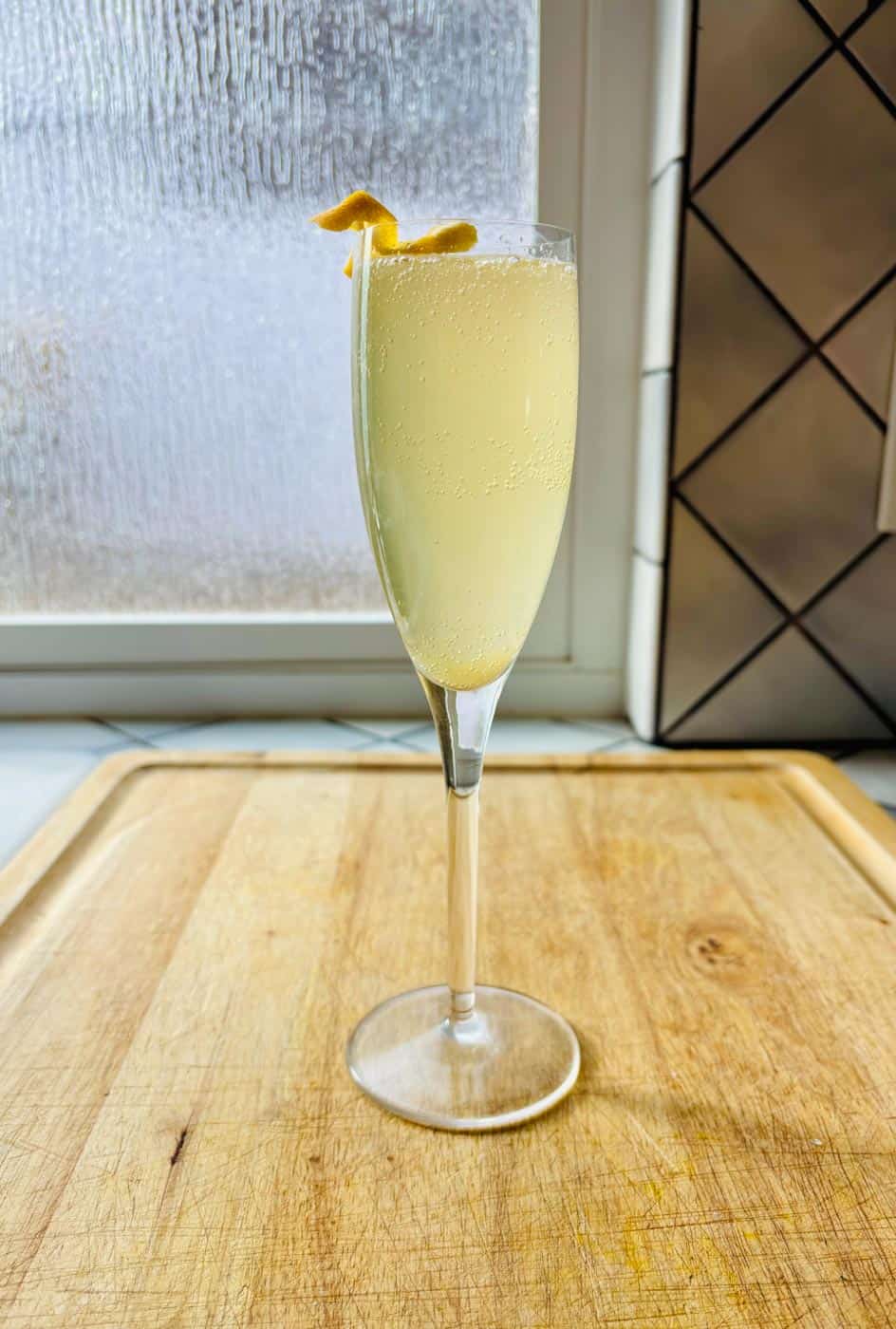 California 75 cocktail with lemon twist garnish.