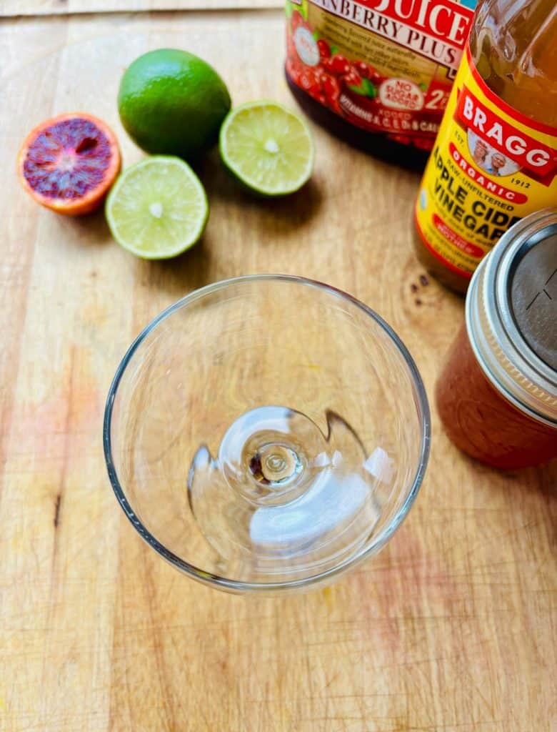 Blood orange, lime, cranberry juice, apple cider vinegar, and blood orange simple syrup.