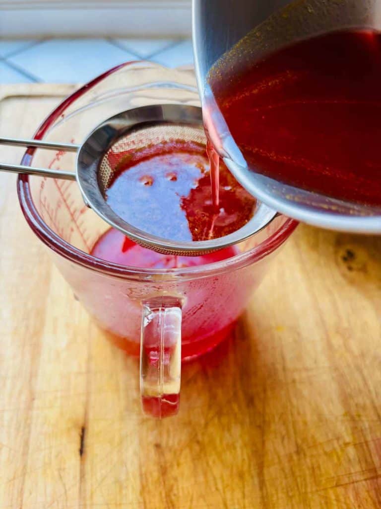 Straining the syrup.