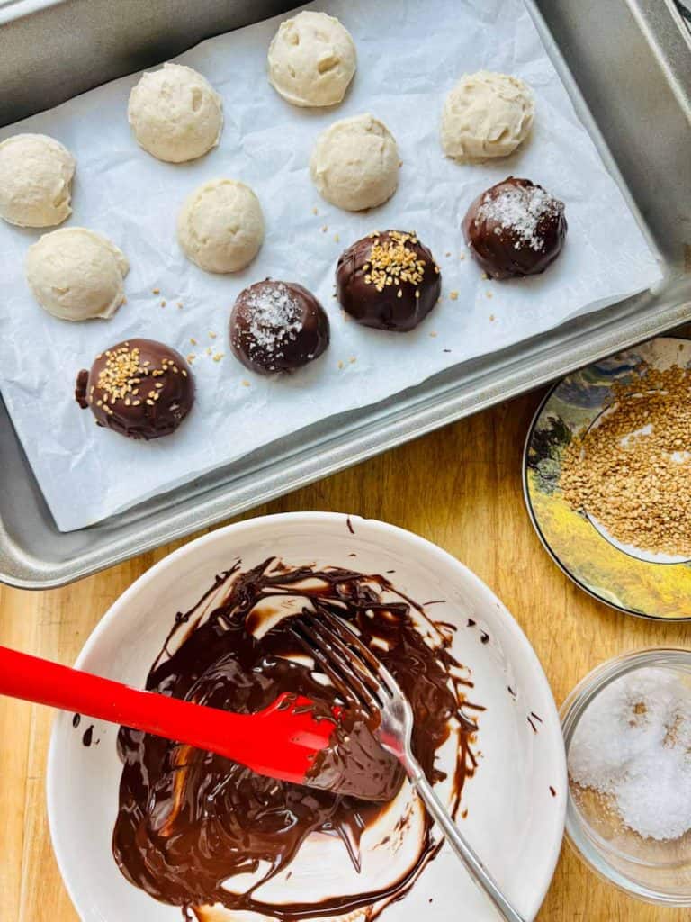 The yogurt bites get dunked in chocolate.