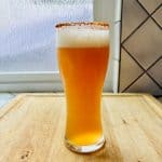 Michelada, Mexican beer cocktail in a glass.