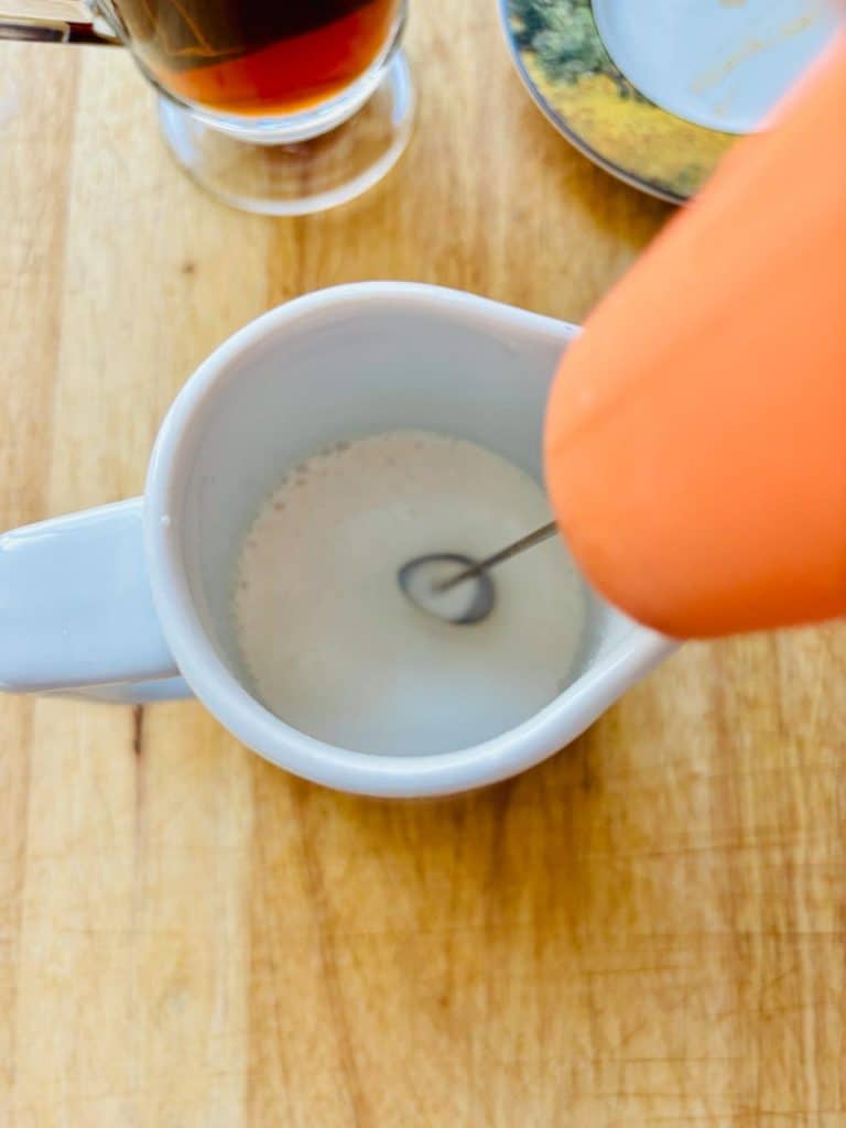 Whipping the cream and vanilla.