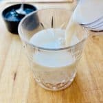 Banana milk poured into glass.