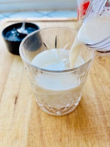 Banana milk poured into glass.