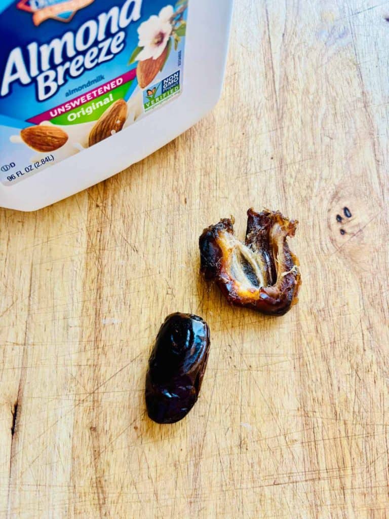 Unsweetened almond milk and two dates.