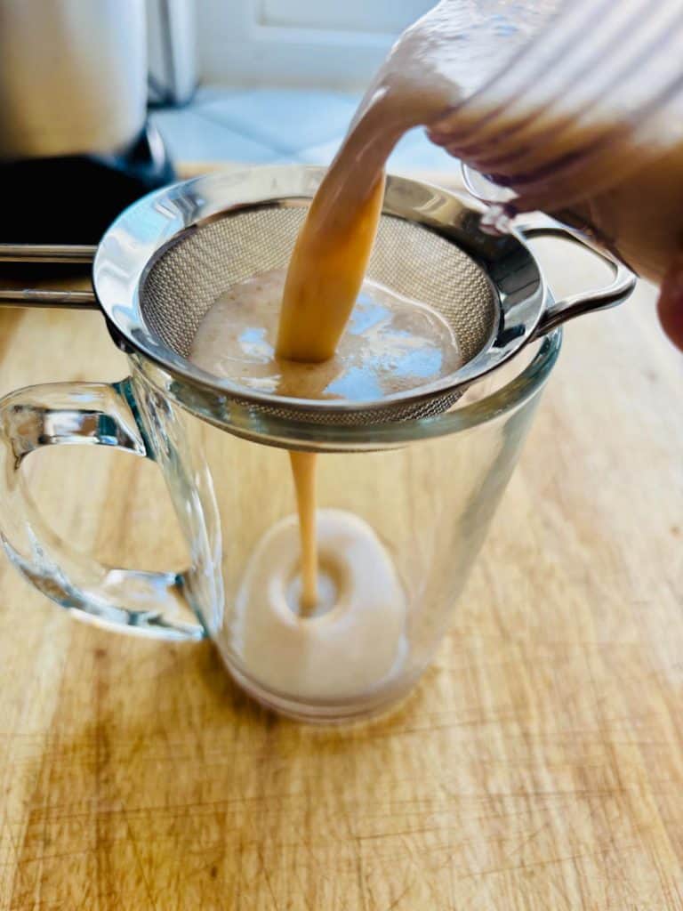 Straining date milk.