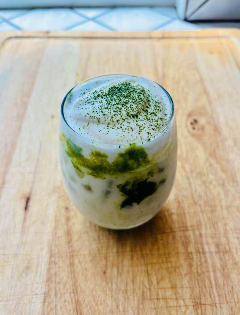 Finished drink garnished with matcha.