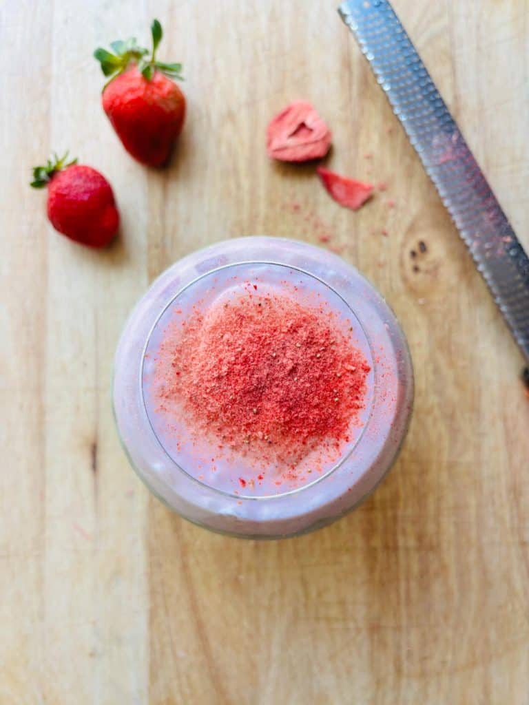 Grated freeze-dried strawberry garnish.