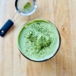 Matcha cold foam dusted with matcha powder.