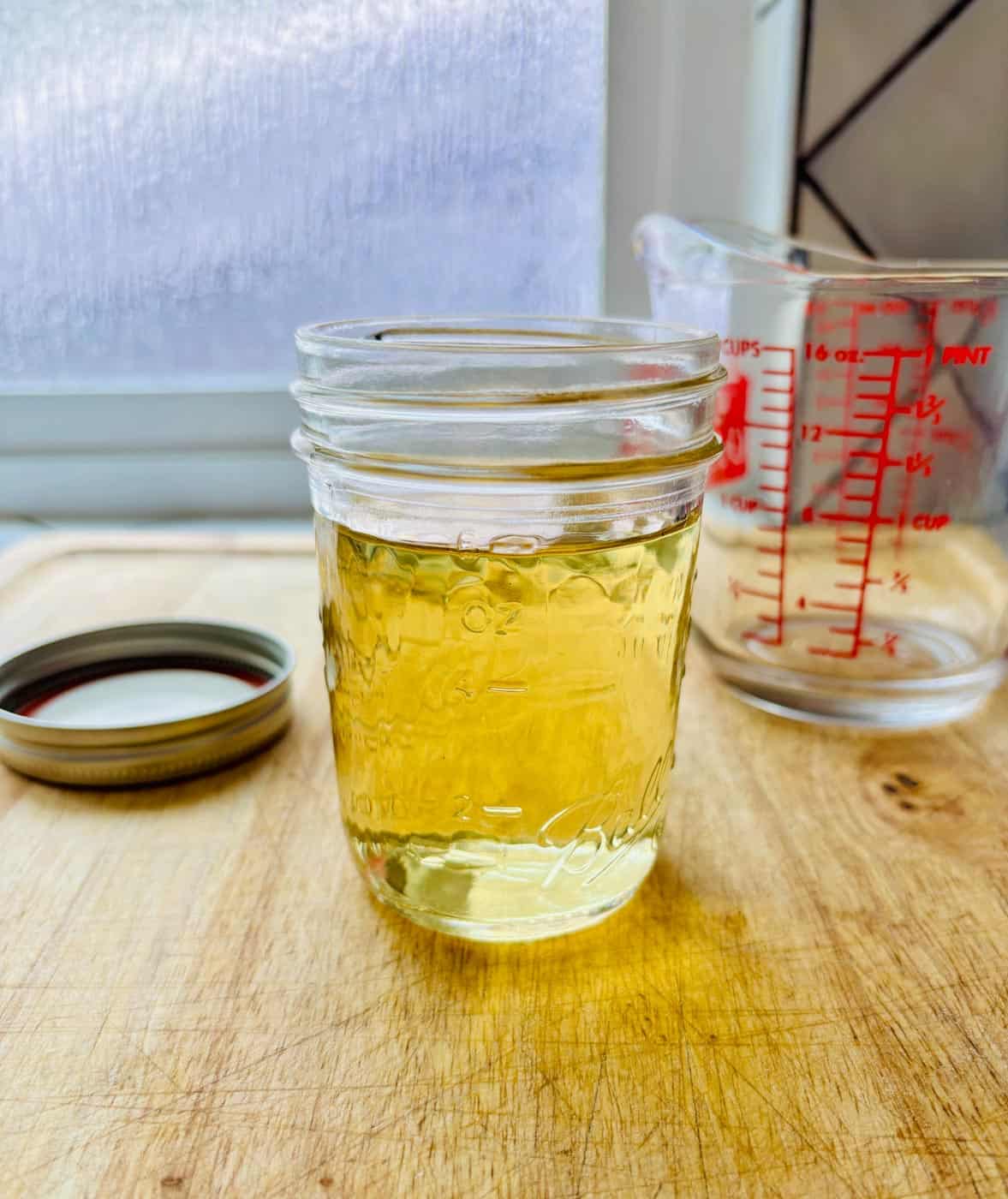 Simple syrup on a wooden board.