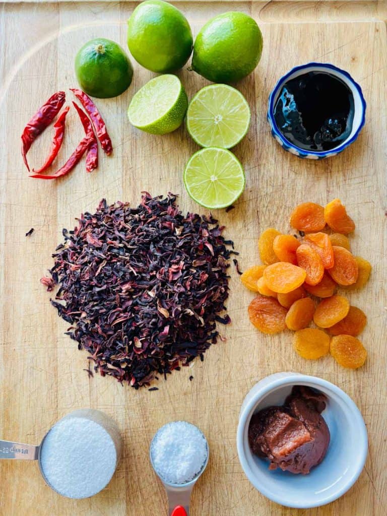 Dried chilis, lime, tamarind concentrate, apricots, umeboshi paste, hibiscus flowers, and salt.