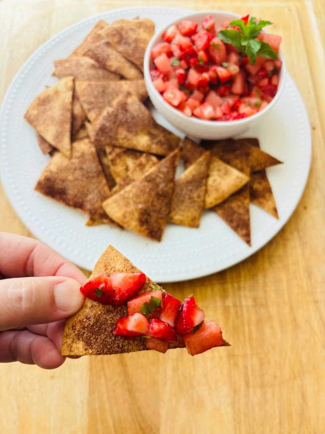 Cinnamon chip with fruit salsa, ready to bite.