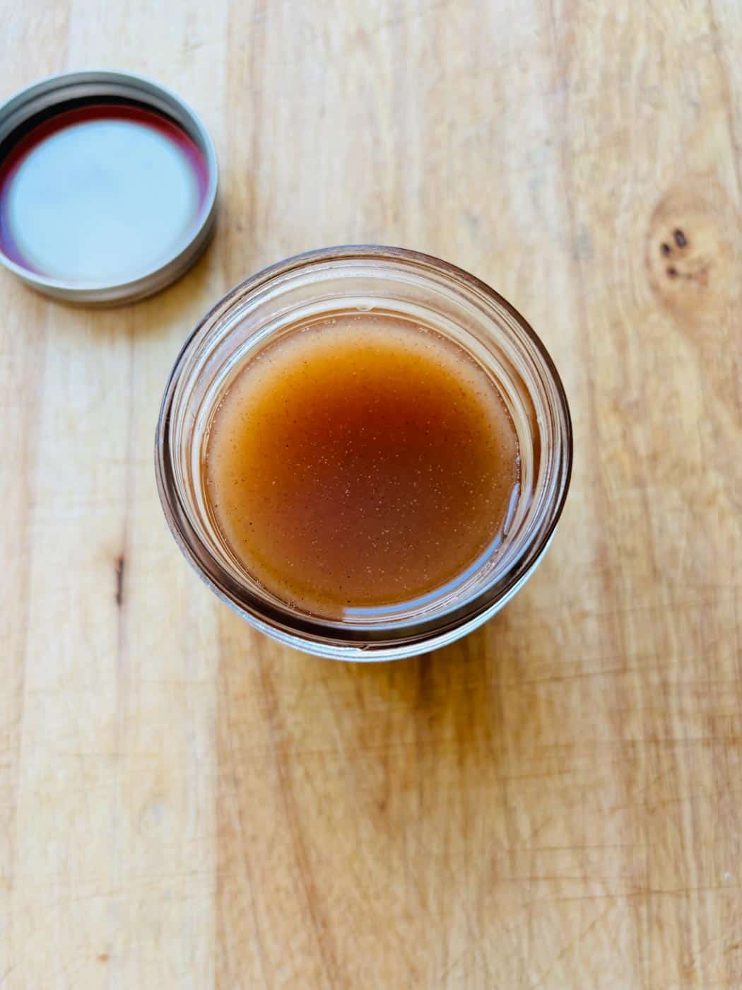 Overhead view of horchata syrup in a mason jar.