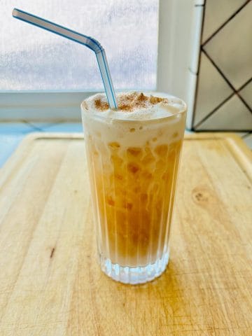 Iced Chai Latte with a straw.