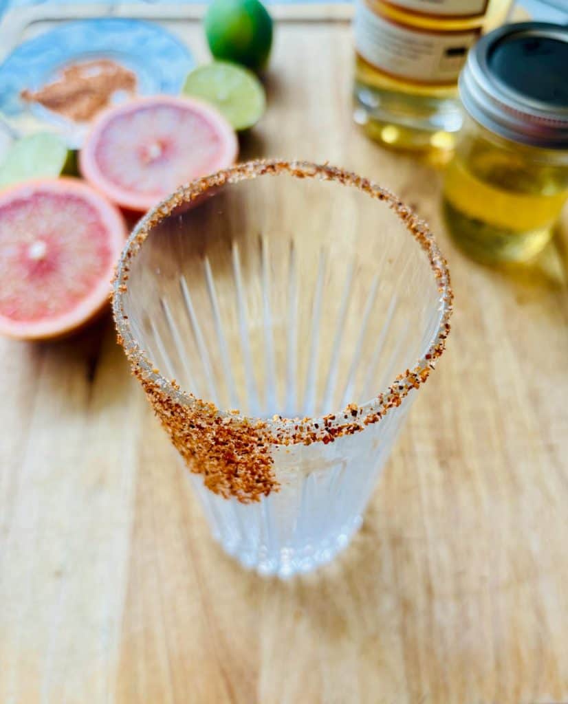 Grapefruit, lime, tequila, simple syrup, and a Tajin-rimmed glass.