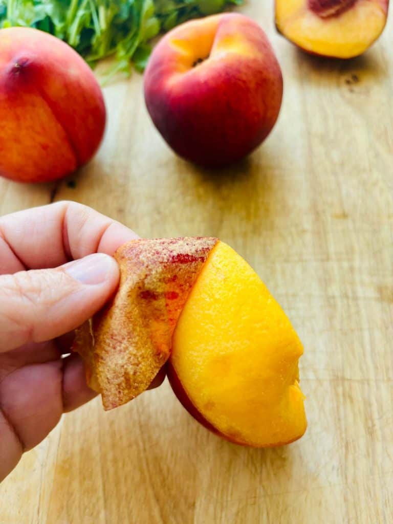 Peeling a peach.