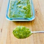 Spoon of salsa verde.