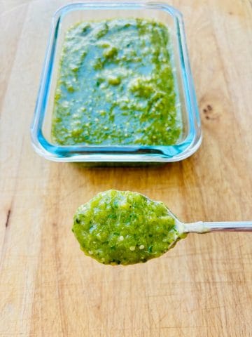 Spoon of salsa verde.