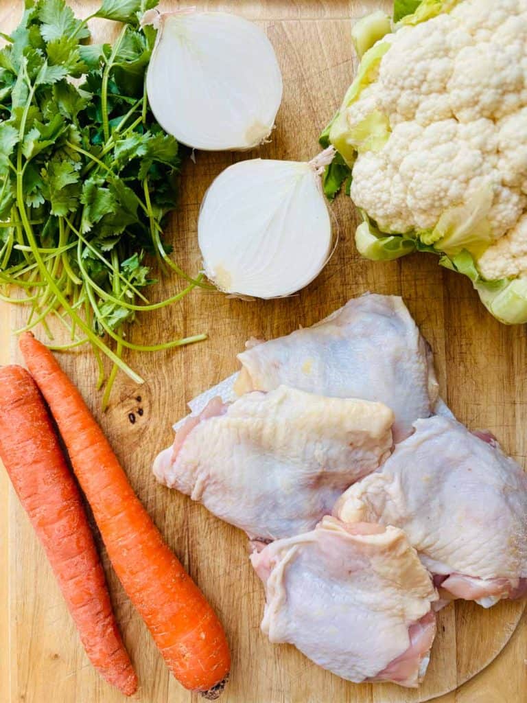 Cilantro, onion, cauliflower, chicken, and carrots.