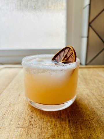 Salty Dog cocktail with garnish.
