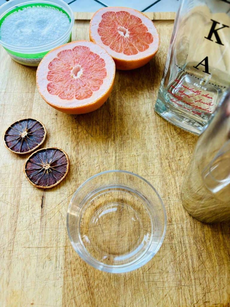 Coarse salt, fresh pink grapefruit, vodka, dried citrus rounds.